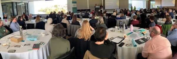 Guests at the Healthy Tasmania Community Forum listening to a keynote presentation from Professor Billie Giles-Corti.