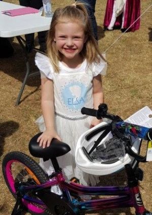 girl with bike - Devonport Community House bicycle winners